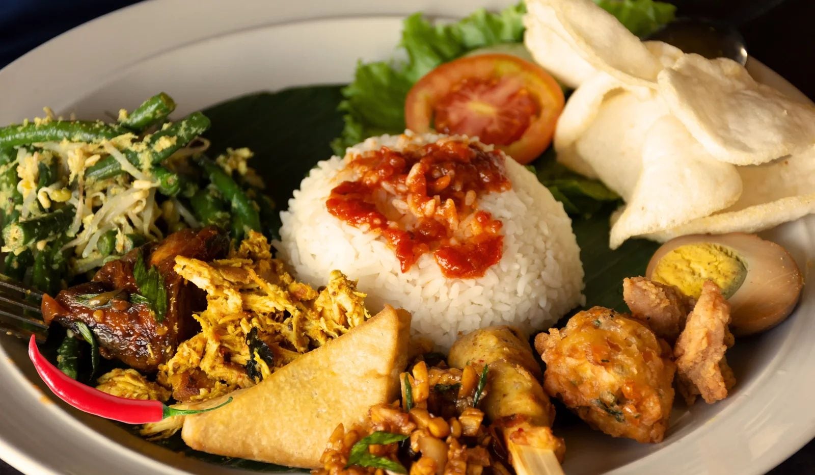 Nasi Campur is a dish that offers a unique fusion of various flavors 